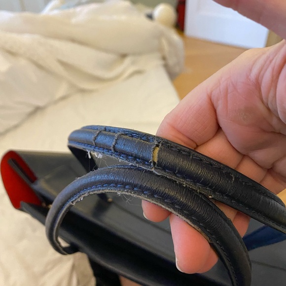 Tory Burch zip up Robinson navy blue tote with orange interior. - Picture 9 of 11